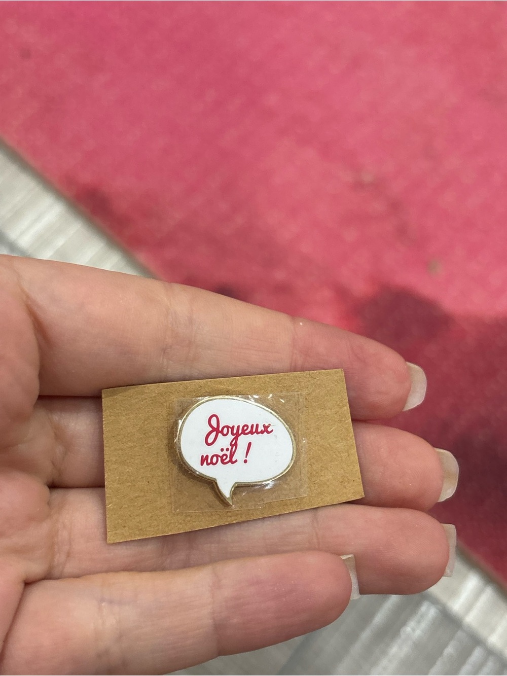 Clarins Red and White 'Joyeux Noël!' Speech Bubble Pin